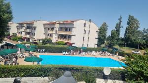 a view of a hotel with a swimming pool at Domus Flavio in Marina di Cerveteri