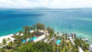 an aerial view of a resort and the ocean at Appartement cosy hôtel Carayou - Grenade 178 in Les Trois-Îlets