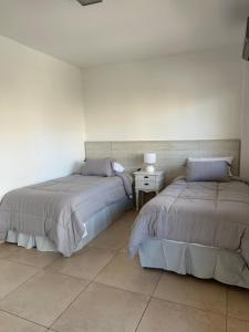 En eller flere senge i et værelse på Departamento exclusivo + 56 billeder