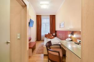 Postel nebo postele na pokoji v ubytování Hotel Pension Baronesse