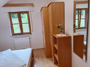 Postel nebo postele na pokoji v ubytování Privatzimmer am Weinbrunnen