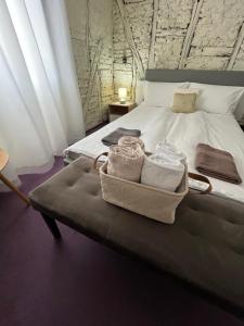 a bedroom with a bed with towels on it at Къща Христини in Kalofer