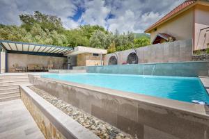 a swimming pool in the backyard of a house at Villa Oaza with Outdoor Pool in Kotor