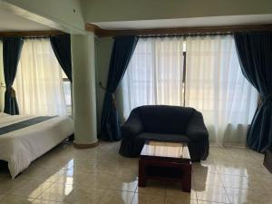 Giường trong phòng chung tại EXCELLENT HOTEL KAMPAlA