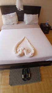 Una cama o camas en una habitación de Dagm