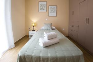 Ένα ή περισσότερα κρεβάτια σε δωμάτιο στο Mastiha Luxury Suites