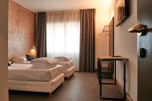 TV a/nebo společenská místnost v ubytování Hotel Due Ragni e Ristorante