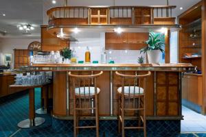 Kuchyň nebo kuchyňský kout v ubytování Hotel Pension Baronesse