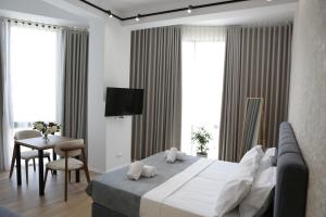 TV a/nebo společenská místnost v ubytování Hotel La Rosa