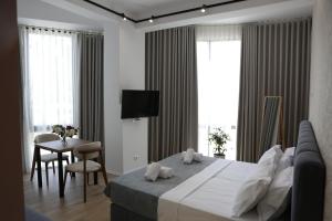 TV a/nebo společenská místnost v ubytování Hotel La Rosa