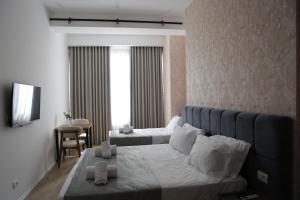 Postel nebo postele na pokoji v ubytování Hotel La Rosa