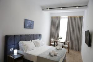 Postel nebo postele na pokoji v ubytování Hotel La Rosa