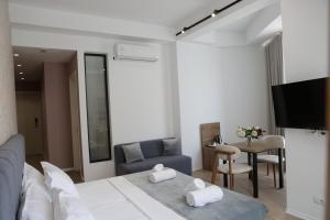 TV a/nebo společenská místnost v ubytování Hotel La Rosa