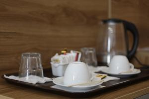 Příslušenství pro přípravu čaje a kávy v ubytování Hotel La Rosa