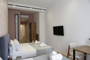 TV a/nebo společenská místnost v ubytování Hotel La Rosa