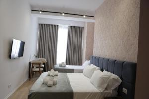 Postel nebo postele na pokoji v ubytování Hotel La Rosa
