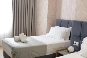 Postel nebo postele na pokoji v ubytování Hotel La Rosa