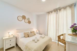 Ένα ή περισσότερα κρεβάτια σε δωμάτιο στο Elite Suite Málaga