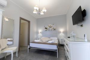 Letto o letti in una camera di Bed and Breakfast Arcobaleno