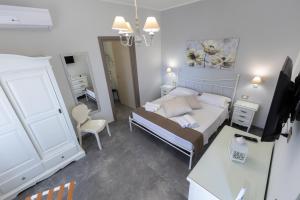 Letto o letti in una camera di Bed and Breakfast Arcobaleno