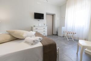 Letto o letti in una camera di Bed and Breakfast Arcobaleno