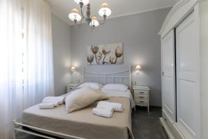 Letto o letti in una camera di Bed and Breakfast Arcobaleno