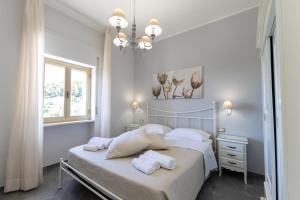 Letto o letti in una camera di Bed and Breakfast Arcobaleno