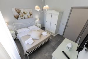 Letto o letti in una camera di Bed and Breakfast Arcobaleno