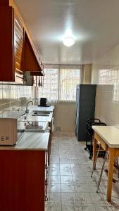 Kuchyň nebo kuchyňský kout v ubytování LOS IRIS PLAYA DE GANDIA- Apartamento Familiar