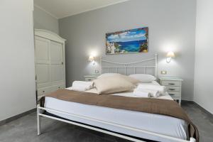Letto o letti in una camera di Bed and Breakfast Arcobaleno
