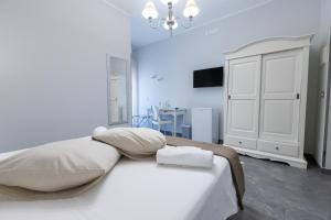Letto o letti in una camera di Bed and Breakfast Arcobaleno