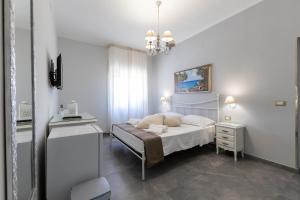 Letto o letti in una camera di Bed and Breakfast Arcobaleno