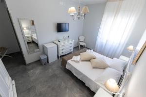 Letto o letti in una camera di Bed and Breakfast Arcobaleno