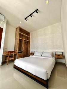 a bedroom with a large white bed in a room at Bukawa Residences Balangan in Jimbaran +67 photos