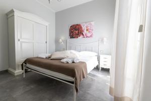 Letto o letti in una camera di Bed and Breakfast Arcobaleno