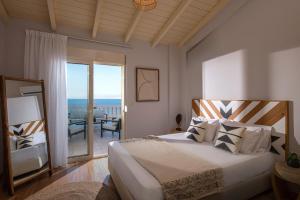 Postel nebo postele na pokoji v ubytování Indigo Sunrise Villas