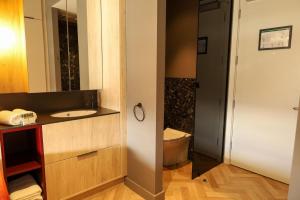 a bathroom with a sink and a toilet at Niche Living Ballsbridge in Dublin
