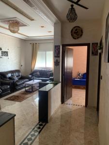 a living room with a couch and a table at Soofhouse in Fez +5 photos