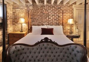 Ένα ή περισσότερα κρεβάτια σε δωμάτιο στο Foley House Inn