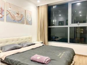 Ένα ή περισσότερα κρεβάτια σε δωμάτιο στο luxury apartment at times city p12-02