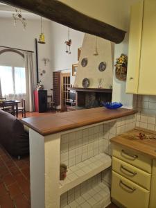 a kitchen with a counter top in a room at Casa Alima in Suvereto