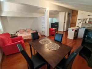 a living room with a dining table and a bedroom at Villa Finera in Premantura