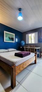 Ένα ή περισσότερα κρεβάτια σε δωμάτιο στο Rancho Acácia São Roque