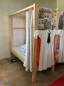 a wooden bunk bed in a room at Hostel du chateau in Saint-Émilion +11 photos