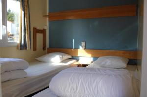 Postel nebo postele na pokoji v ubytování Camping Le Balcon de Chartreuse