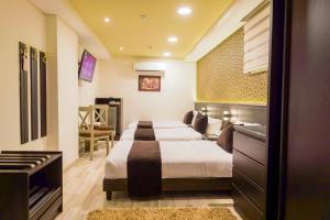 Postel nebo postele na pokoji v ubytování Royal Day + 54 fotografií