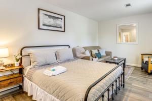 a bedroom with a bed and a couch at Private Backyard Oasis Spacious Home in Humble! in Houston