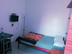 Postel nebo postele na pokoji v ubytování Thekkekara Budget Rooms