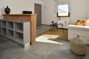 TV a/nebo společenská místnost v ubytování L'Abbraccio della Quercia - Apartments