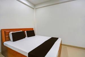 Postel nebo postele na pokoji v ubytování Hotel O Amantran Residency + 23 fotografií